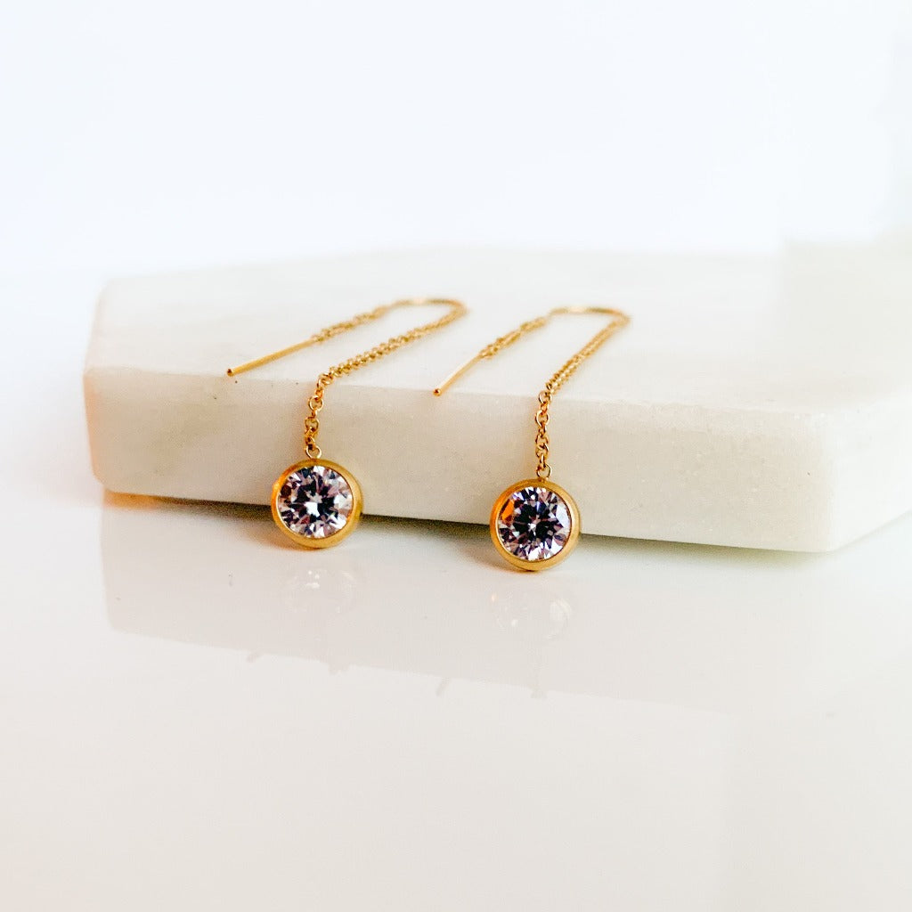 gold filled threader chain earrings with bezel CZ drops that dangle on the end.