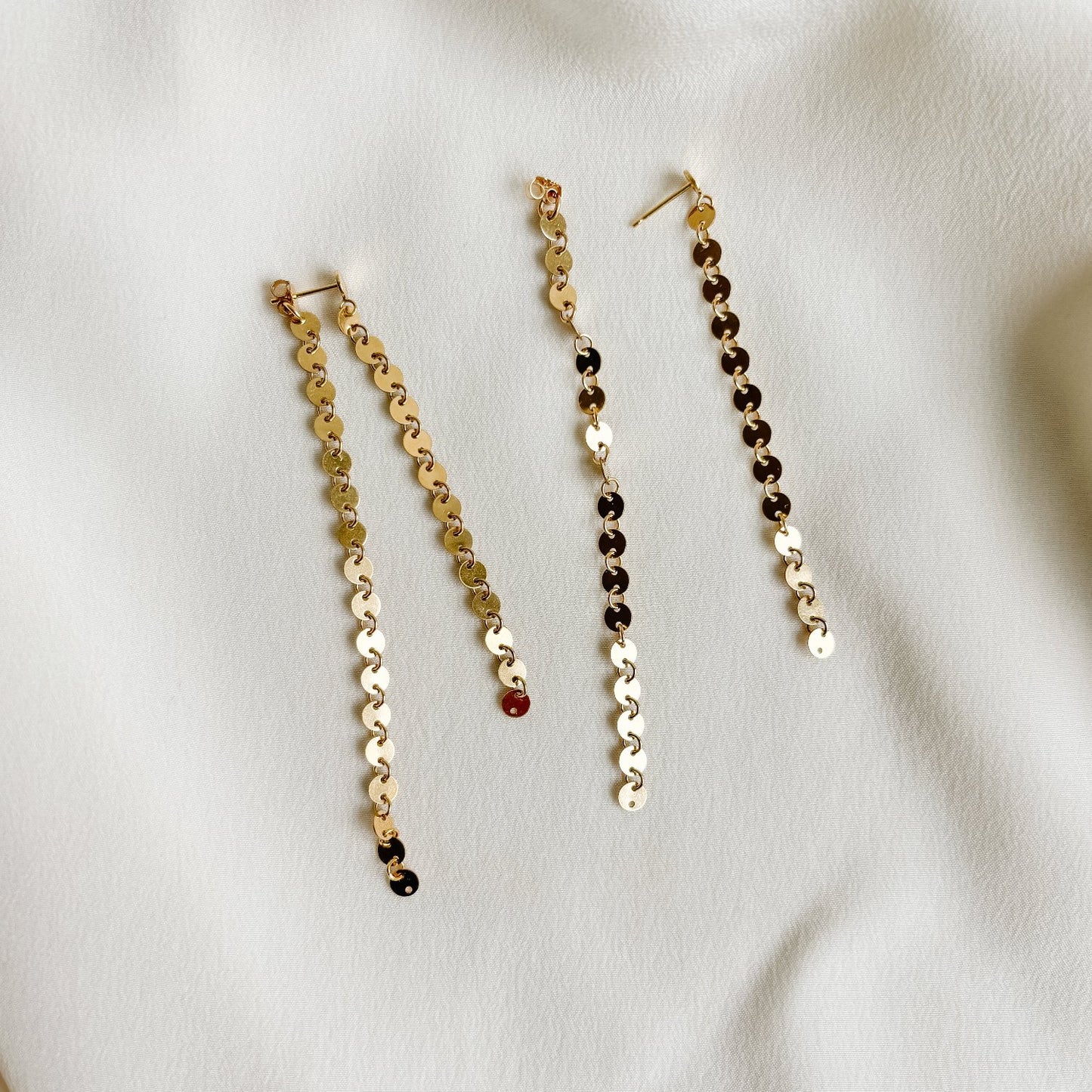 gold disc post earrings in front back design featuring two lengths of gold disc chain.