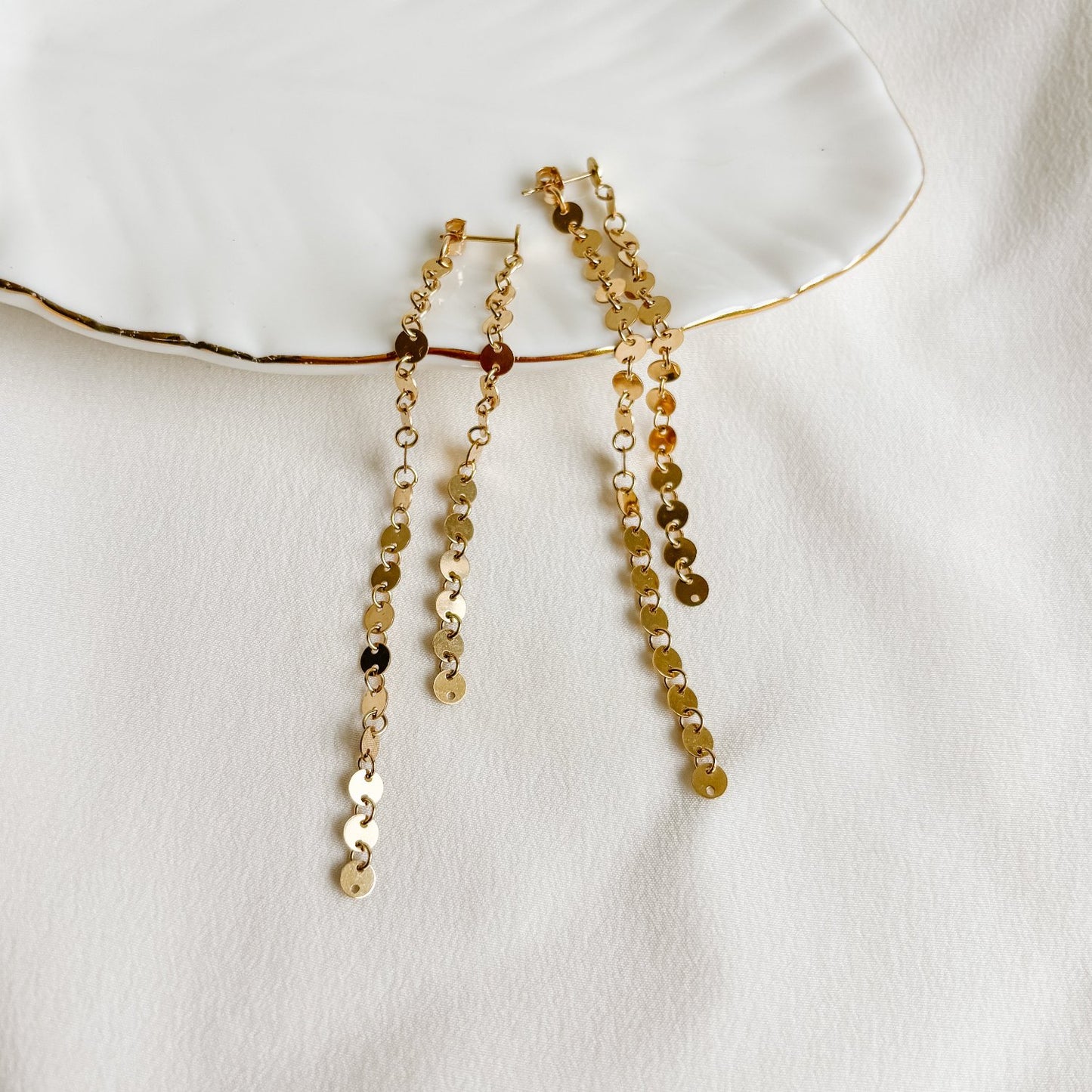 gold disc post earrings in front back design with two lengths of sequin gold disc chains.