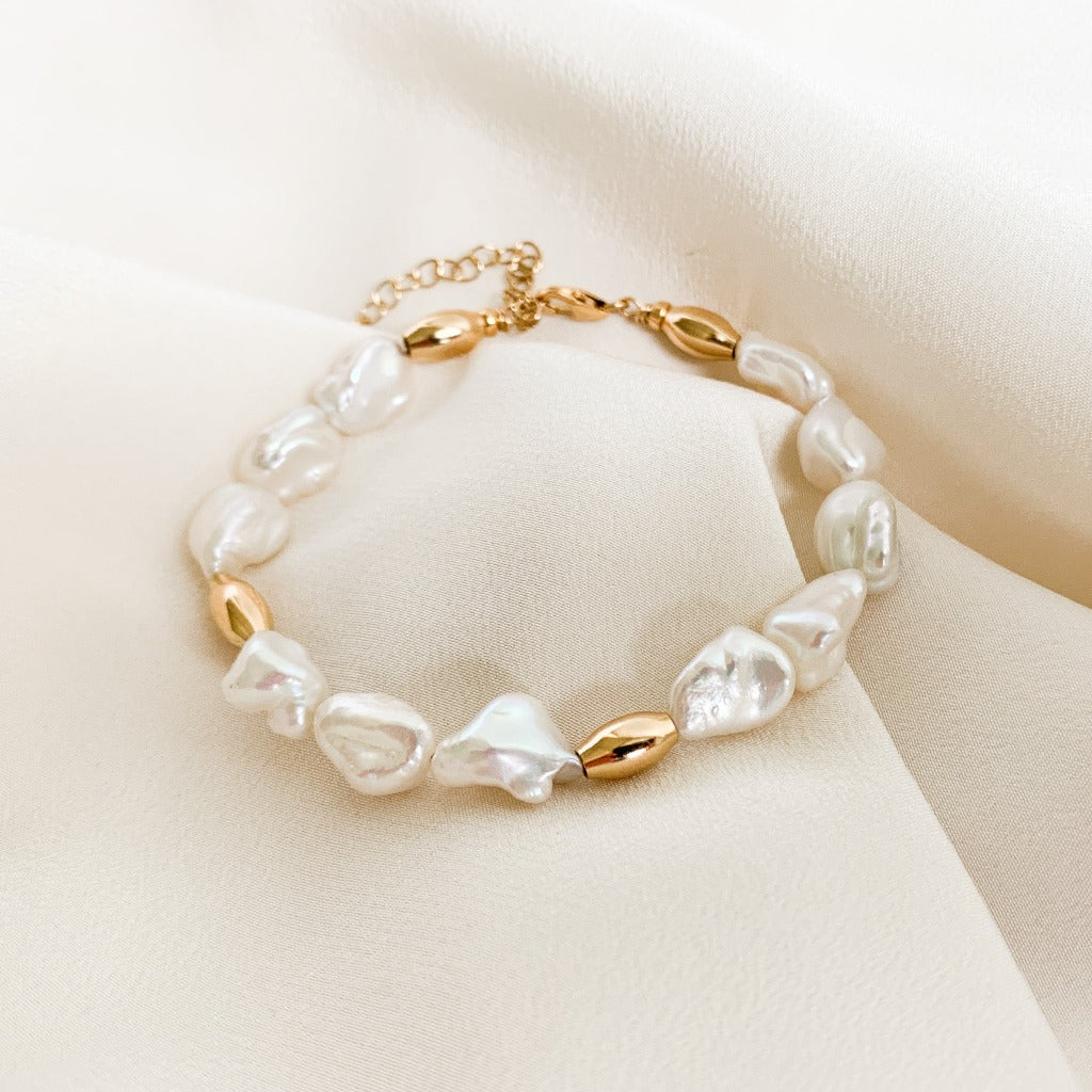 A freshwater keshi pearl bracelet with oval gold bead accents. By Adorned by Ruth