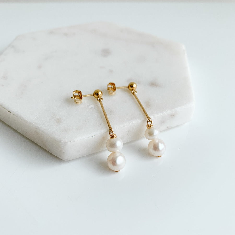 Gold ball  and linear bar with freshwater pearls stud earrings.