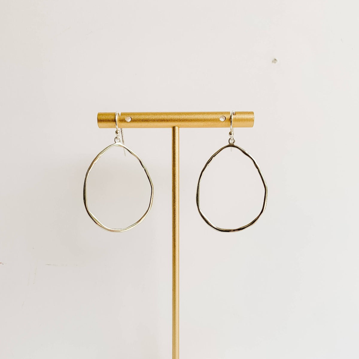 large open organic teardrop shaped hoop earrings in silver