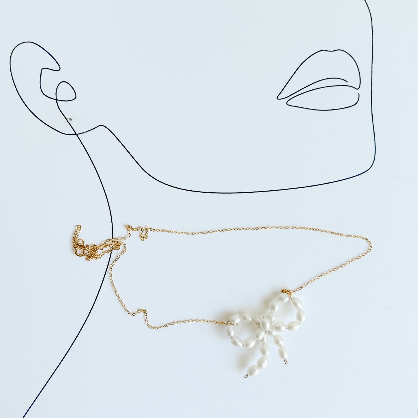 Pearl Bow Tie Ribbon Pendant Necklace