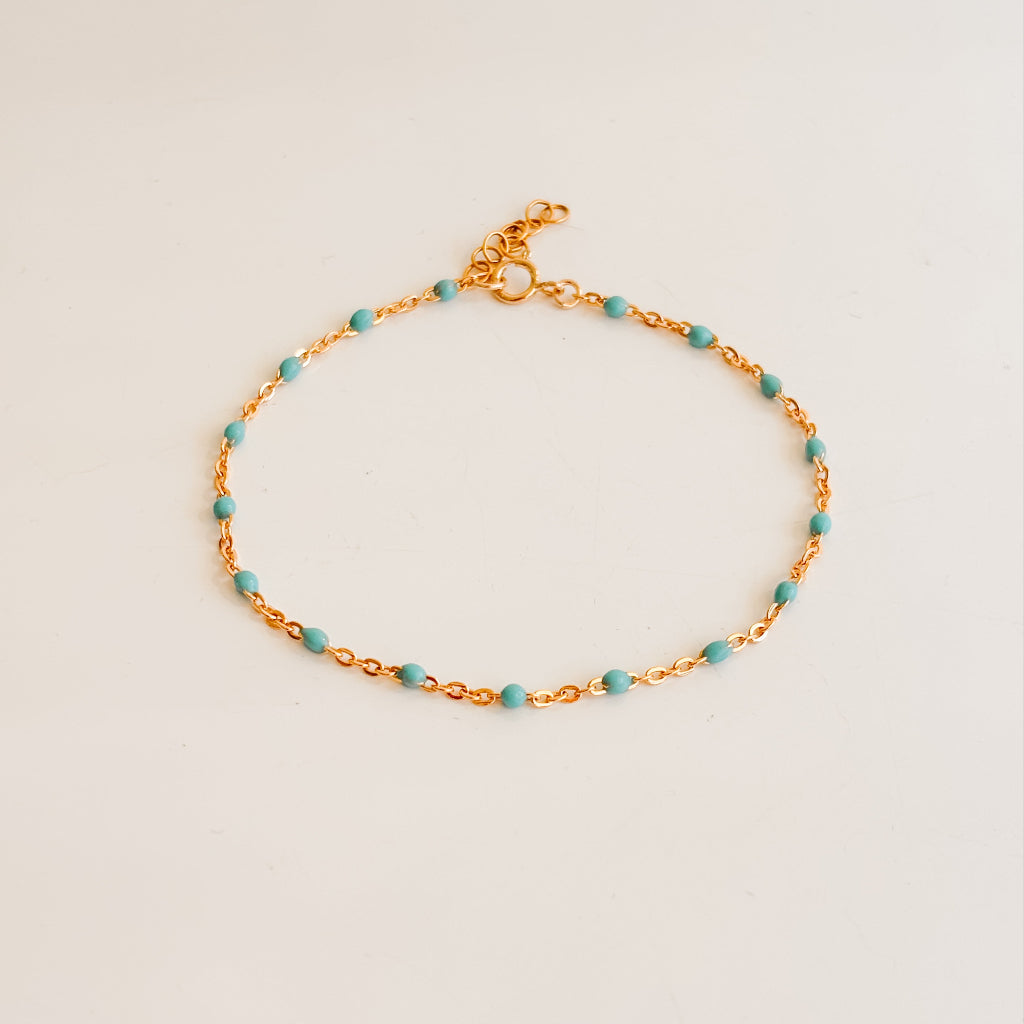 dainty chain bracelet in 14k gold filled featuring turquoise enamel beads