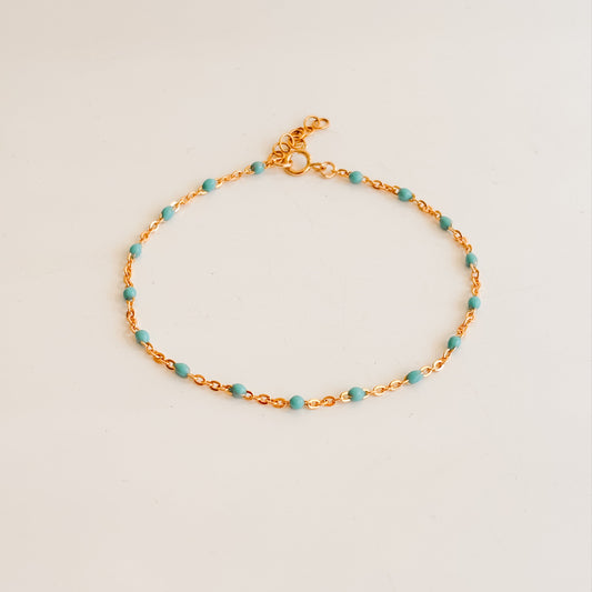 dainty chain bracelet in 14k gold filled featuring turquoise enamel beads