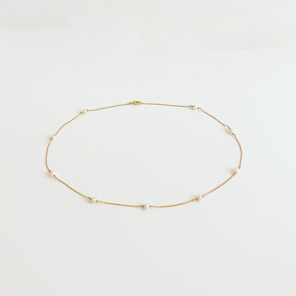dainty 14k yellow gold filled pearl station necklace.