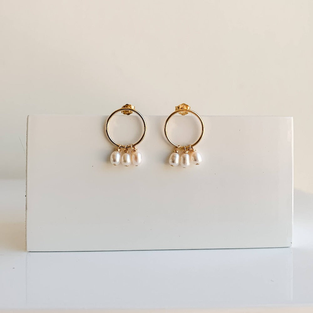 modern pearl earrings front-facing circle stud hoops with three petite freshwater pearl dangles. 