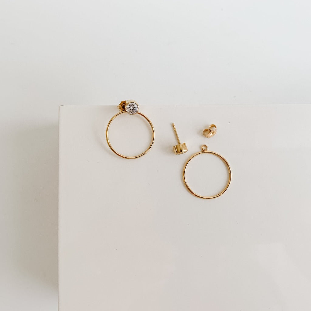 Bezel CZ post earrings in gold filled with open circle ear jackets that can be worn in front or behind ear lobe.  