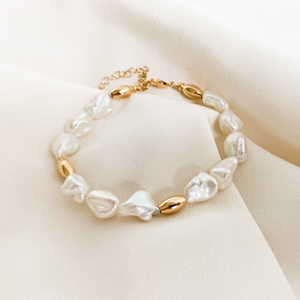 A freshwater keshi pearl bracelet with oval gold bead accents.  By Adorned by Ruth