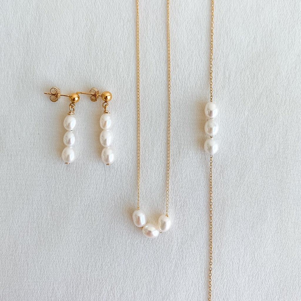 a capsule collection of earrings, bracelet and necklace featuring 3 petite oval pearls. 