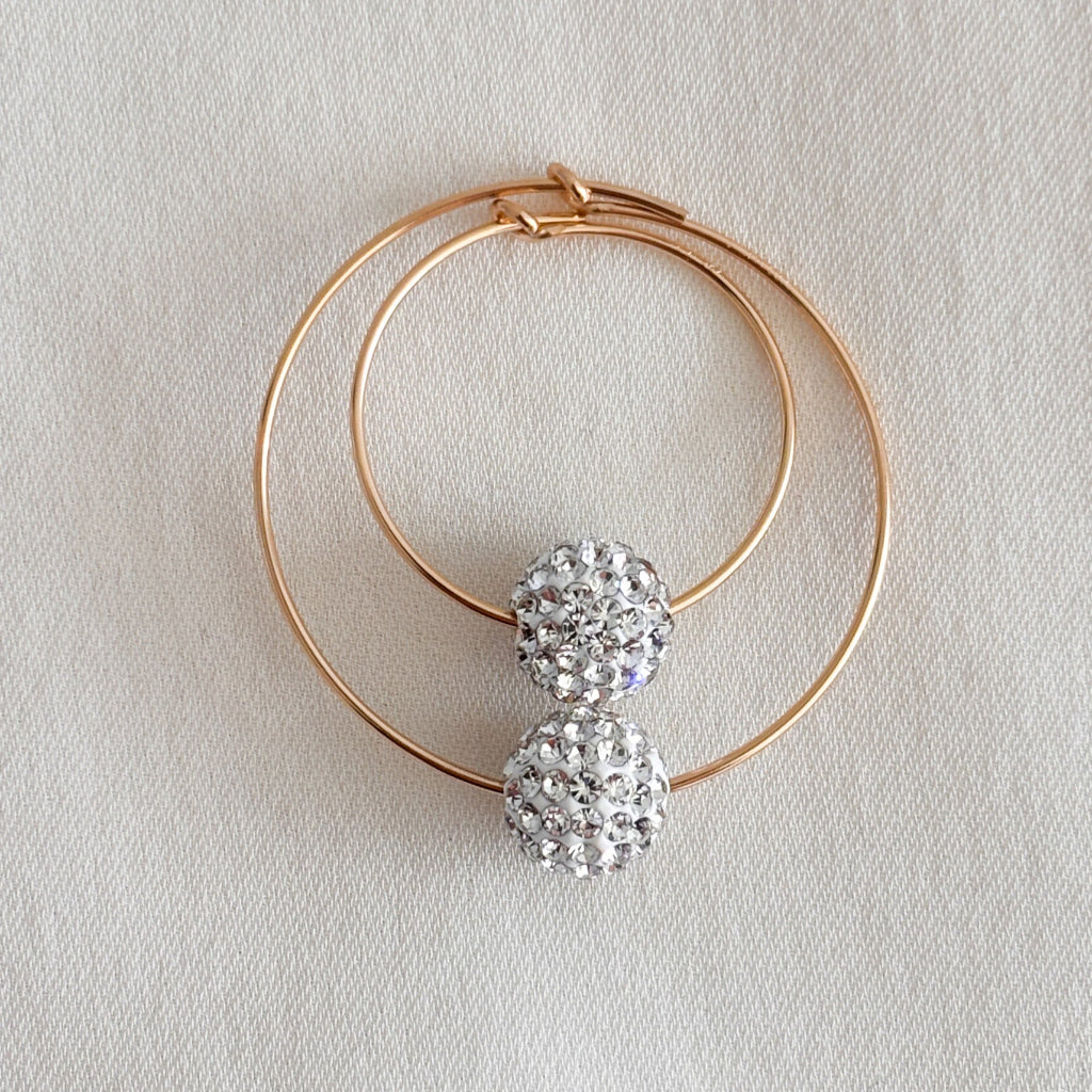 14k gold filled crystal pave hoop earrings shown in 20mm and 30mm with clear pave 8mm beads. 