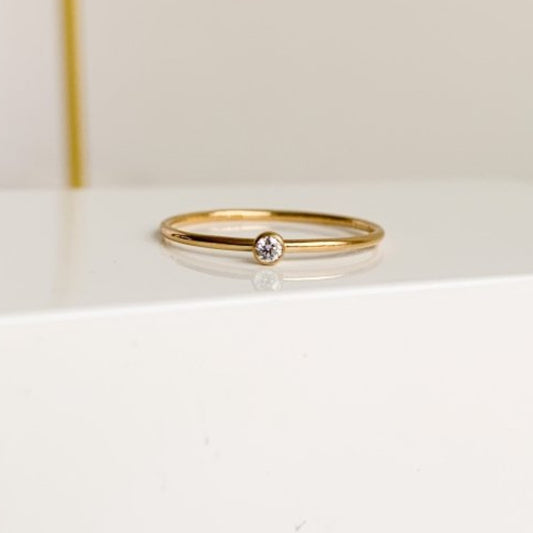 Tiny CZ Stacking Ring - Adorned by Ruth The ring band is 1mm rounded wire and the cubic zirconia is 2mm and bezel set.  